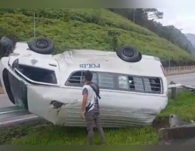 Slippery roads blamed as police vehicle flips on PLUS Expressway near Kuala Kangsar